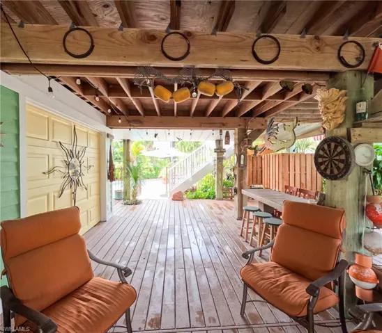 Wooden terrace featuring an outdoor bar