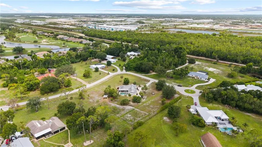 View of property location with a large body of water and nearby suburban area