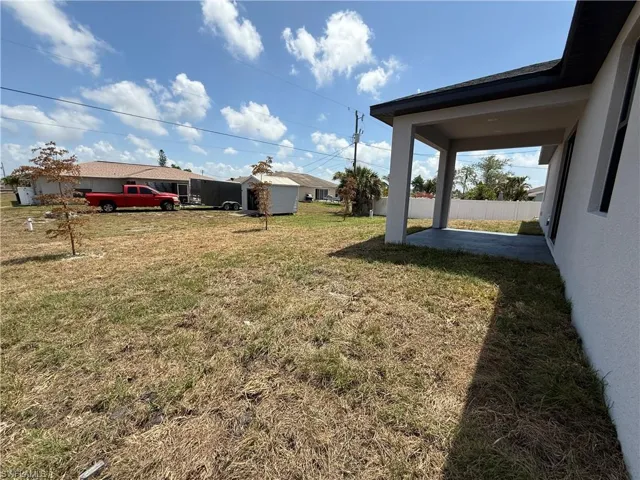 View of yard featuring a patio area and fence