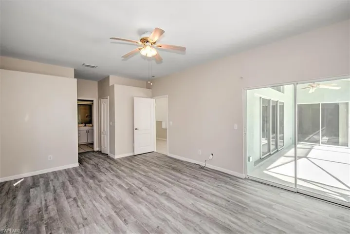 Empty room featuring light hardwood / wood-style flooring and ceiling fan