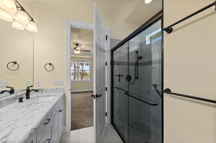 Shower w/new tile surround, new door enclosure, faucet, etc.