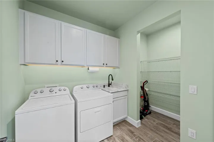Laundry room with additional storage area