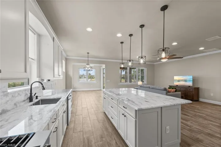Kitchen looking out to dining area, to sunroom