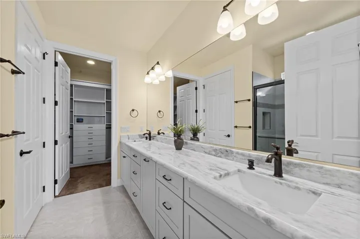 Master bath w/custom finished closet beyone