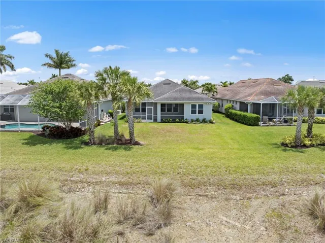 Aerial view of rear of home, w/back yard ready for a pool