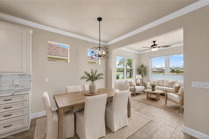 ***VIRTUALLY STAGED*** Dining area looking into sunroom