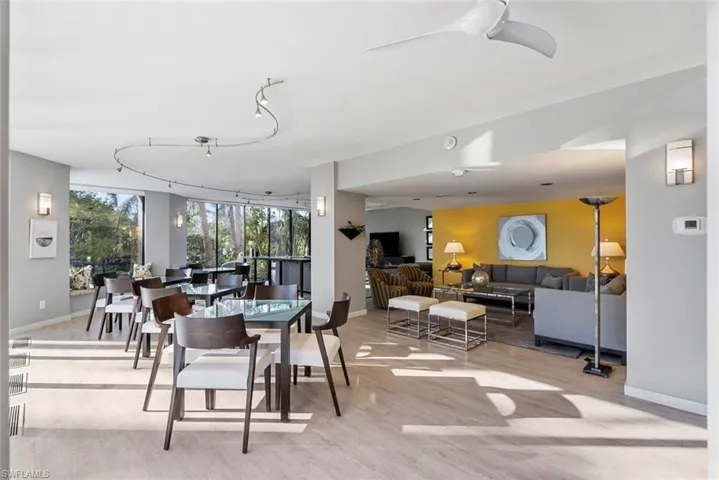 Dining room featuring light wood-type flooring and track lighting