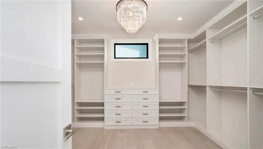Primary Closet With Custom Cabinetry
