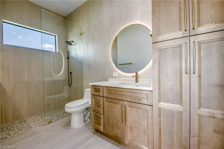Bathroom featuring vanity and a walk in shower