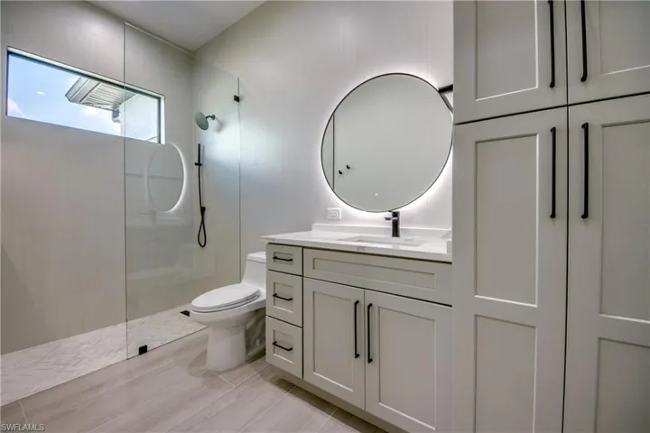 Bathroom with vanity and a walk in shower