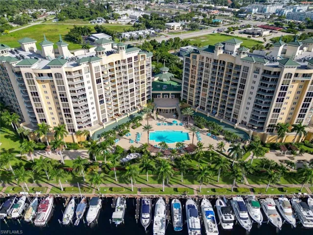 Aerial view of property's location featuring numerous boat docks and a large body of water