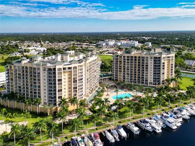 Aerial view of apartment complex and numerous boat docks