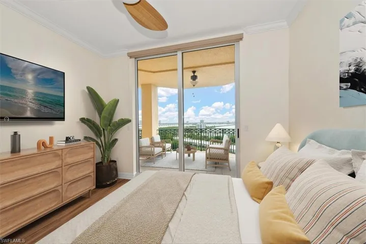 Bedroom featuring dark wood-style floors, ornamental molding, floor to ceiling windows, a ceiling fan, and access to exterior