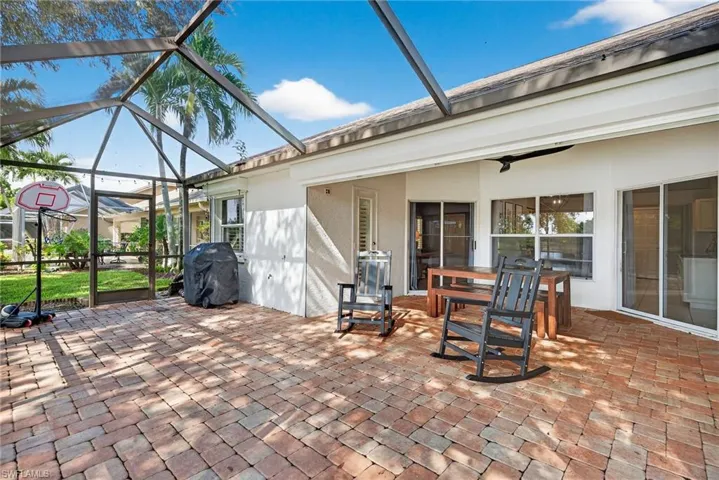 View of patio featuring a sunroom, a lanai, and area for grilling