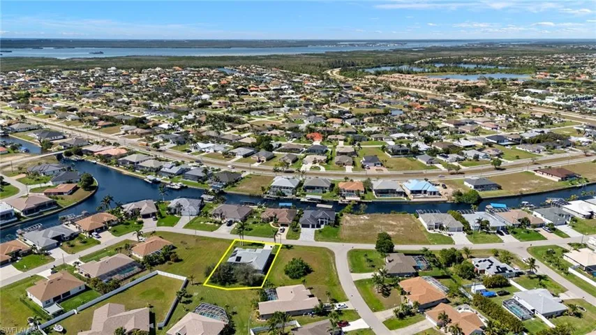 Bird's eye view featuring a water view and a residential view