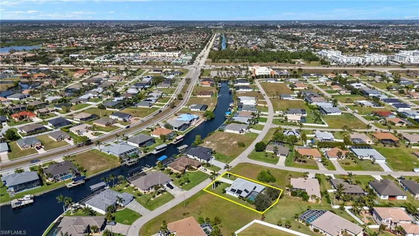 Aerial view featuring a residential view and a water view
