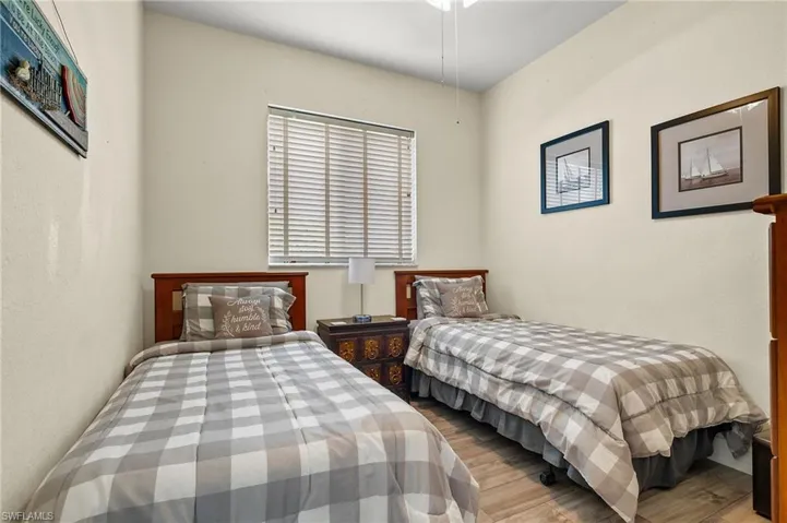 Bedroom with wood-type flooring