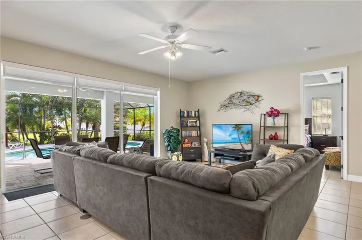 Tiled living room with ceiling fan