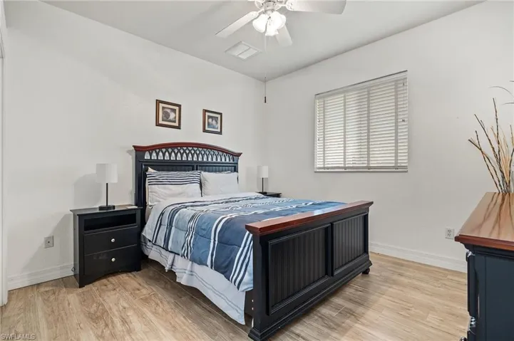 Bedroom featuring ceiling fan and light hardwood / wood-style flooring