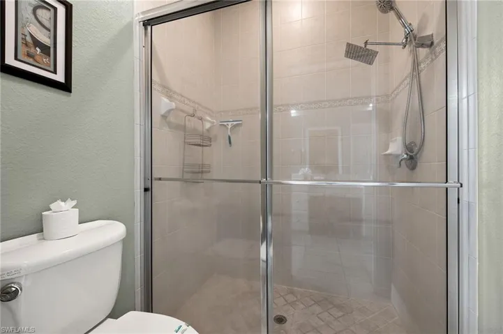 Bathroom with toilet and walk in shower