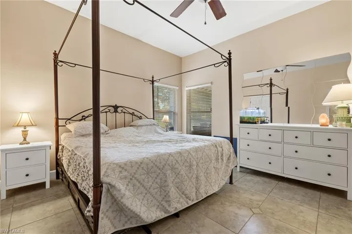 Tiled bedroom with ceiling fan