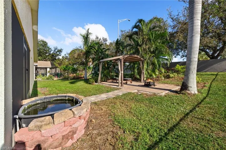 View of yard with a fire pit