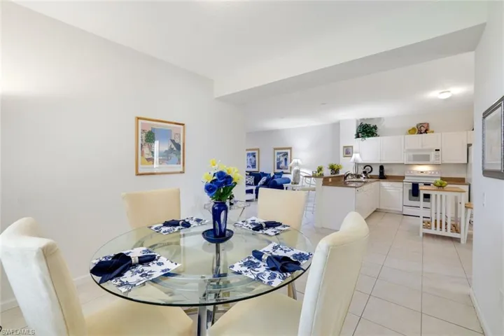 Dining area featuring light tile patterned floors