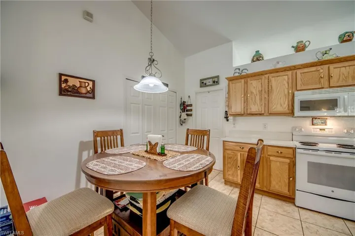 Dining area featuring light tile patterned flooring