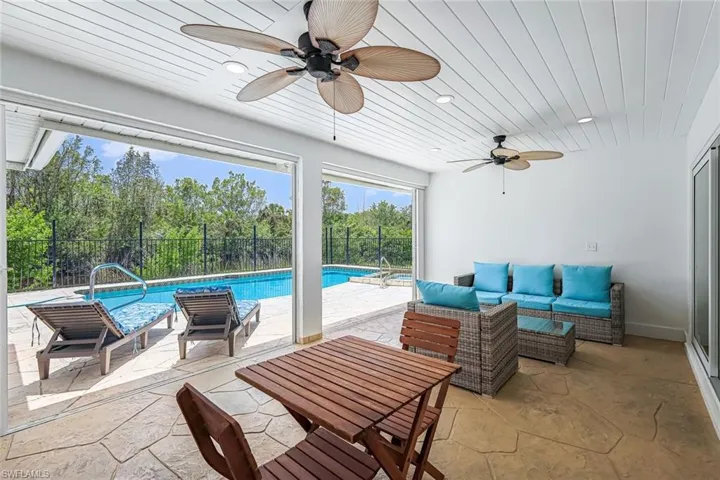 View of patio featuring an outdoor living space and a ceiling fan