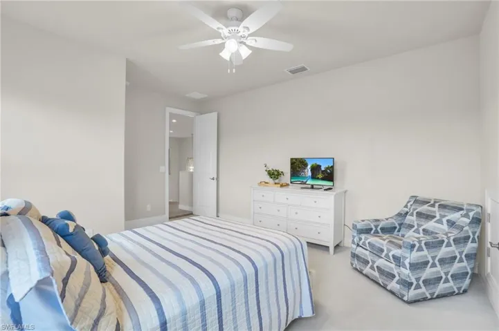 3rd Carpeted bedroom featuring ceiling fan