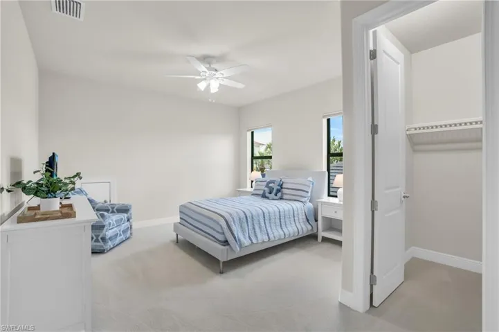 3rd Bedroom featuring ceiling fan and light colored carpet