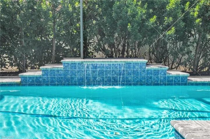 View of pool with pool water feature