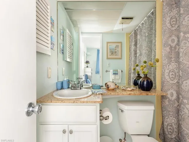 Bathroom shower tub combo, featuring , toilet, and vanity