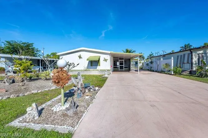 View of front facade featuring a carport