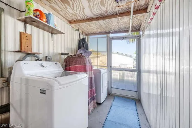 Washroom with washing machine and dryer