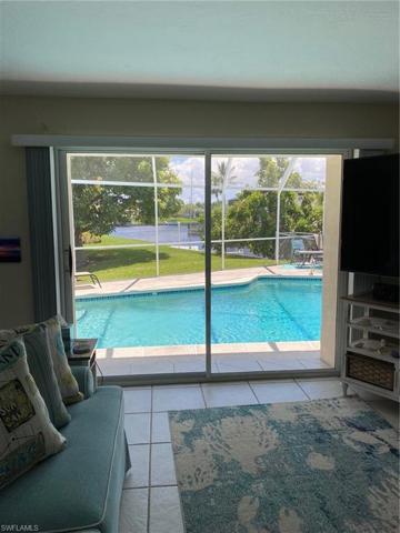 Beautiful view of the pool and canal right from the living room.