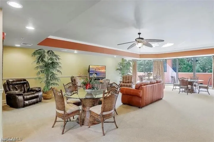 Dining room featuring carpet and ceiling fan