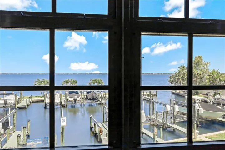 View of water feature with a boat dock