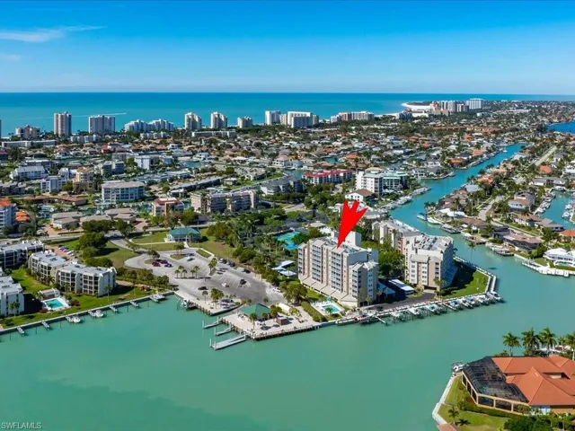View of property location featuring a large body of water and nearby urban area