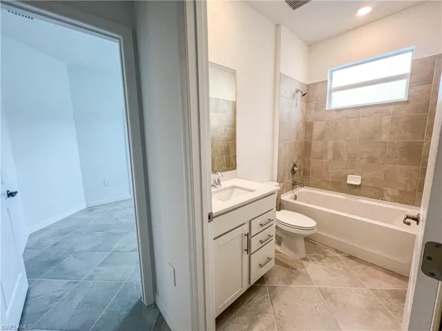 Full bathroom with vanity and tub / shower combination