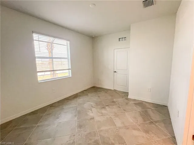 Empty room with baseboards