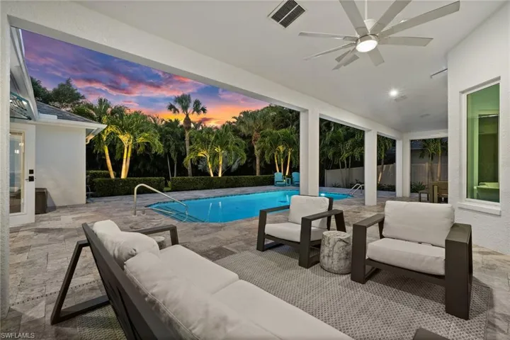 Twilight transforms this outdoor space into a warm, inviting retreat with complete privacy.