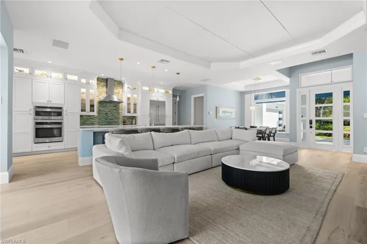 A spacious great room flows seamlessly into the chef’s kitchen — perfect for everyday gathering and entertaining.