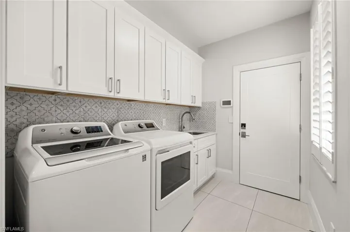 Plenty of cabinetry, modern appliances, and a dedicated sink keep everyday tasks effortless.
