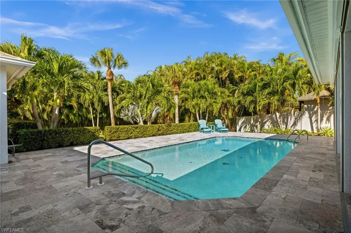 Enjoy a newly resurfaced pool surrounded by palm trees and abundant space for lounging or entertaining.