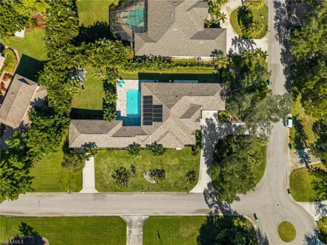 A bird’s-eye view of the open layout, fenced yard, and tropical surroundings that make everyday living feel like vacation.