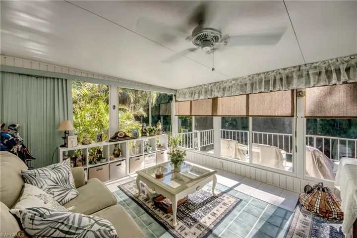 Sunroom with healthy amount of natural light and tile patterned floors