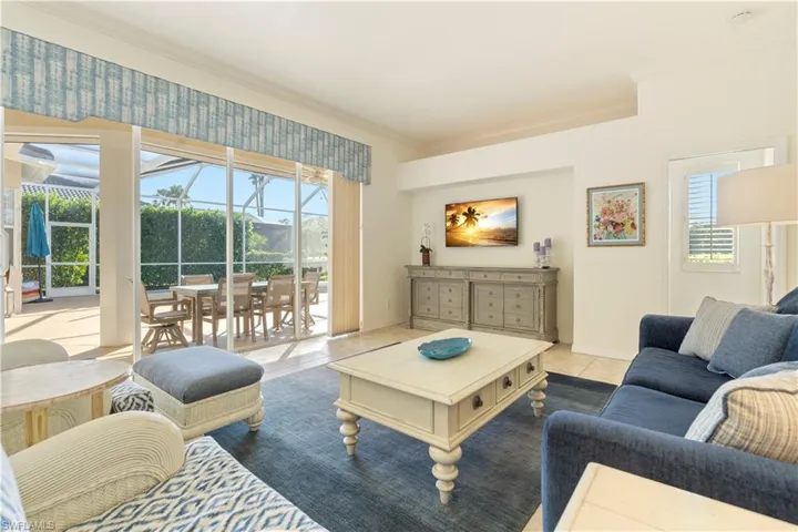 Tiled living room featuring ornamental molding