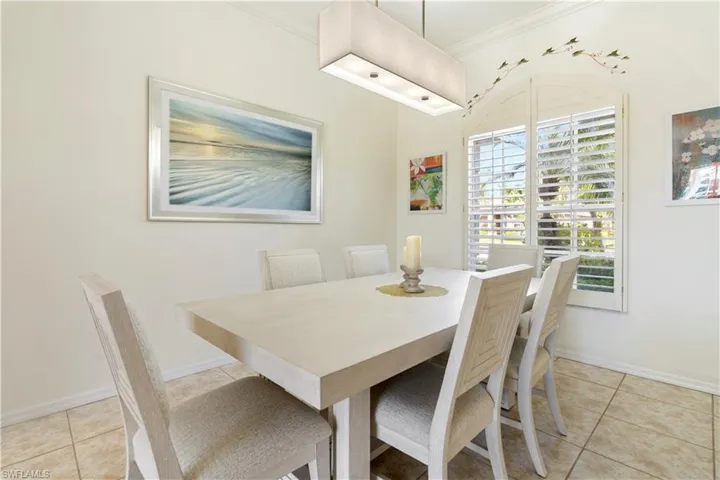 Tiled dining area with ornamental molding