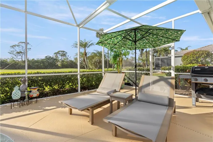 View of patio / terrace with glass enclosure and grilling area